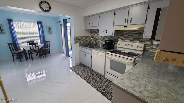 kitchen with backsplash, white appliances, sink, and gray cabinetry