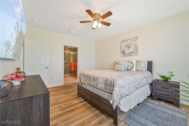 bedroom featuring ensuite bathroom, ceiling fan, and light hardwood / wood-style flooring