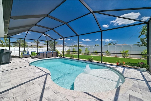 view of pool with a lanai, a patio area, and a fenced backyard