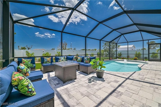 view of pool featuring an outdoor living space, a patio, pool water feature, and glass enclosure