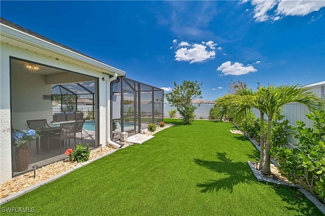 view of yard with a lanai and a patio