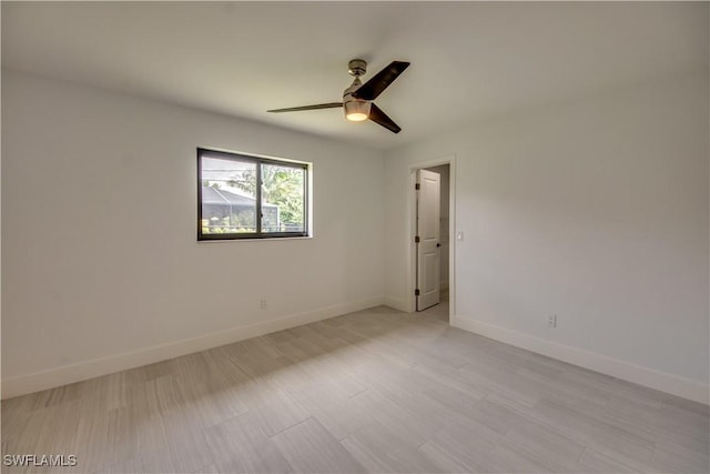 unfurnished room with ceiling fan