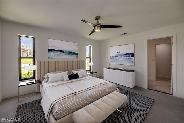 bedroom with multiple windows and ceiling fan