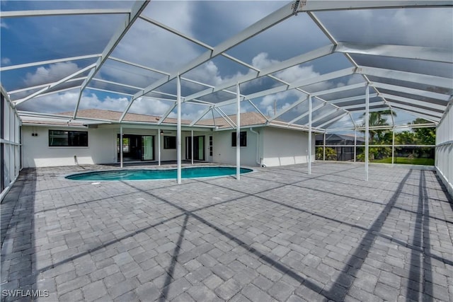 view of pool featuring a lanai and a patio