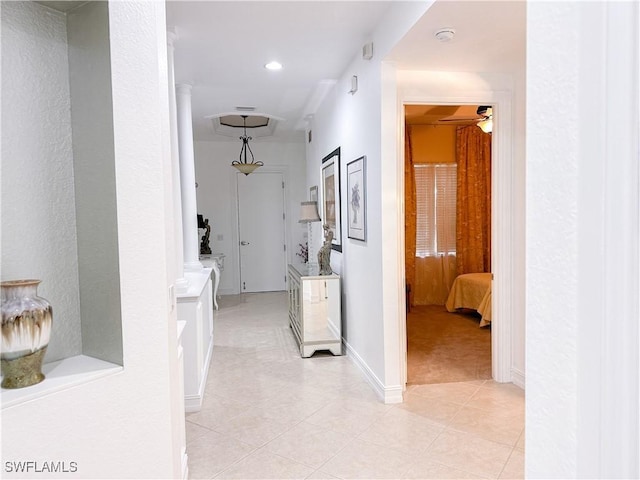 hall with light tile patterned flooring