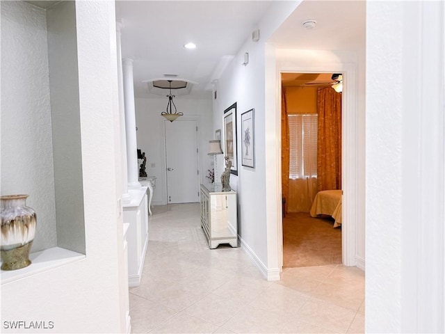 hall with recessed lighting, baseboards, light tile patterned floors, and light carpet