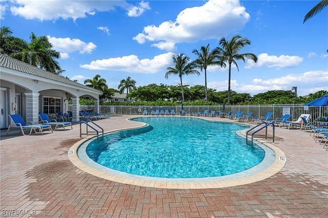 view of swimming pool featuring a patio area