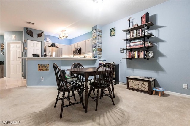 view of carpeted dining area