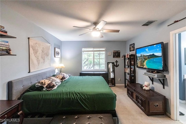 bedroom with light colored carpet and ceiling fan