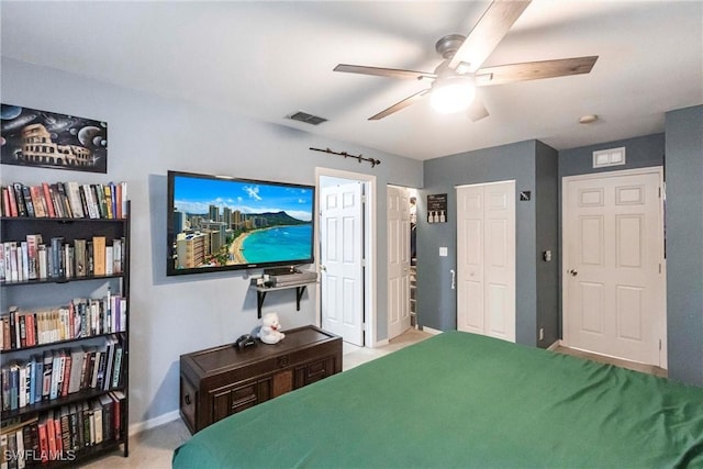 bedroom featuring ceiling fan and light colored carpet