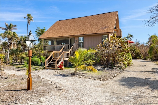 view of front of property featuring a sunroom