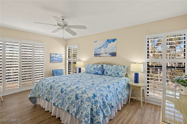 bedroom featuring light hardwood / wood-style floors and ceiling fan