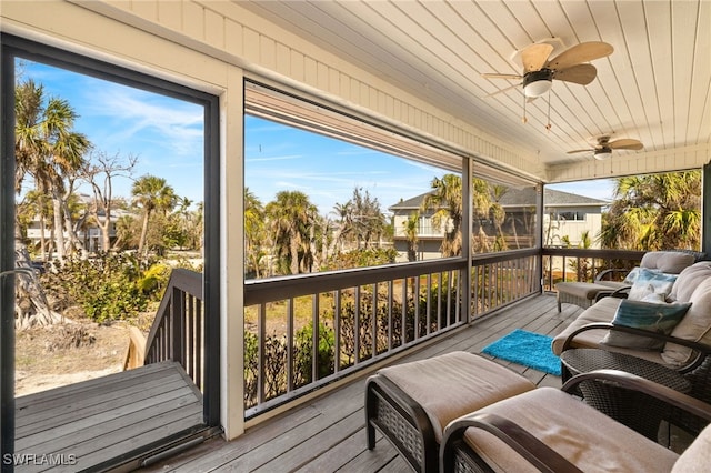 sunroom featuring wooden ceiling and ceiling fan