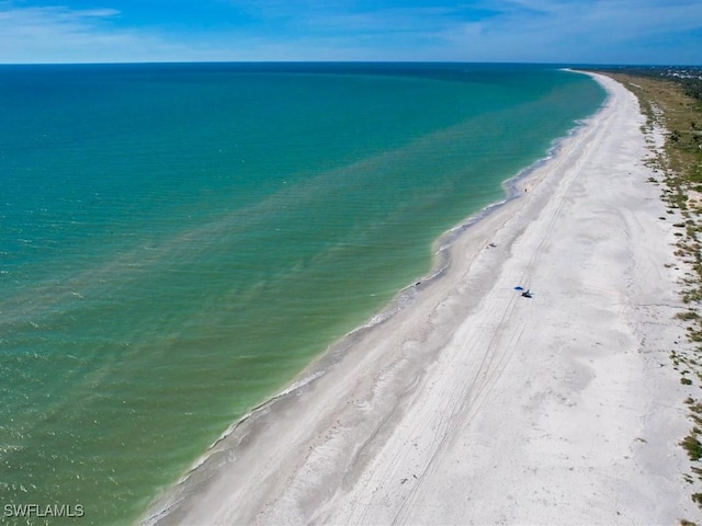 aerial view featuring a beach view and a water view