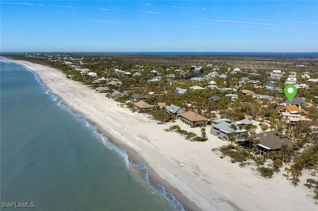 birds eye view of property featuring a view of the beach and a water view