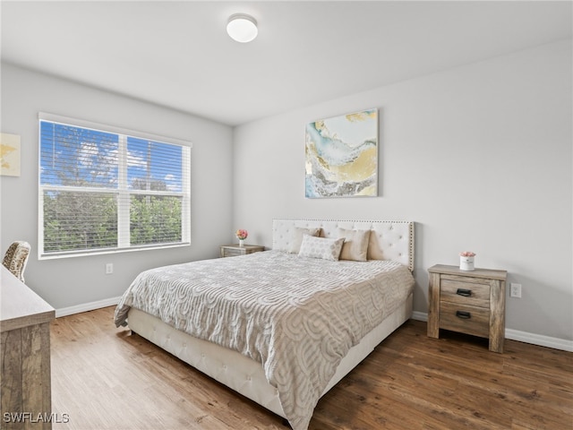 bedroom with hardwood / wood-style flooring