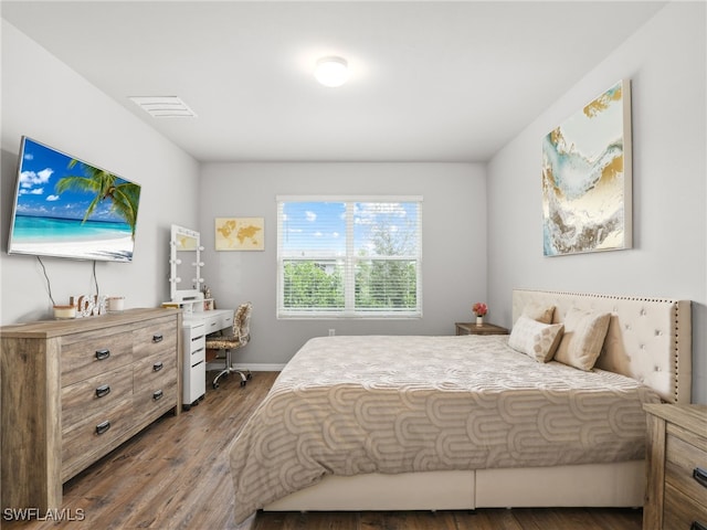 bedroom with hardwood / wood-style floors