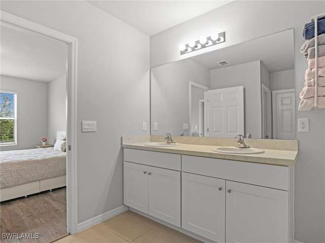 bathroom with vanity and tile patterned floors