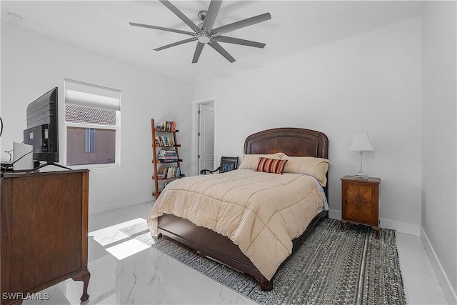 bedroom with marble finish floor, ceiling fan, and baseboards