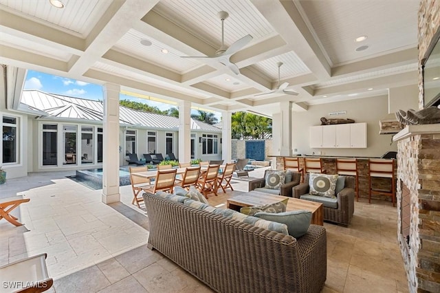 view of patio with an outdoor hangout area, an outdoor bar, and ceiling fan