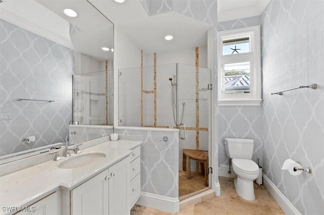 bathroom with a shower with door, vanity, and toilet