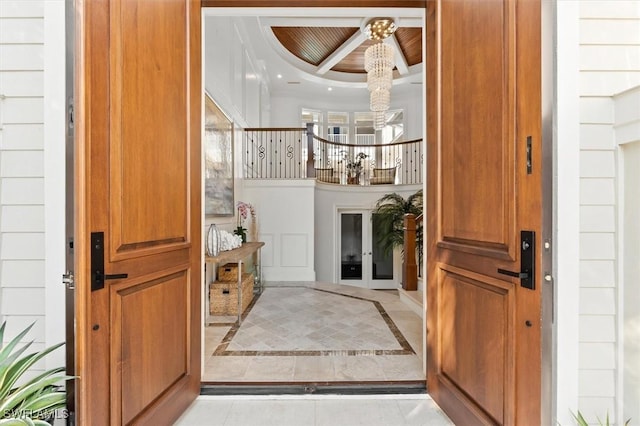 foyer featuring a tray ceiling