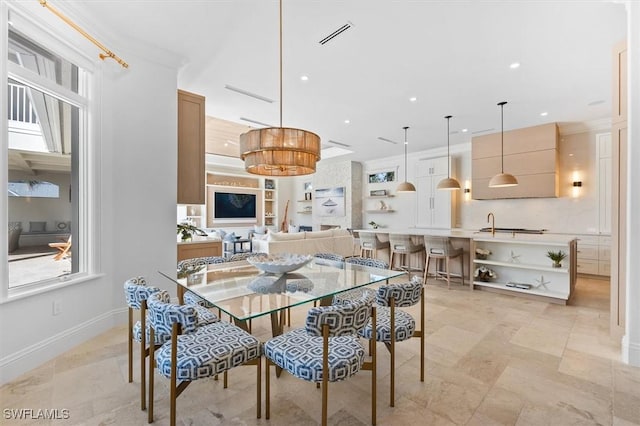 dining space featuring ornamental molding