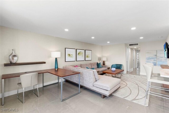 living room with light tile patterned flooring