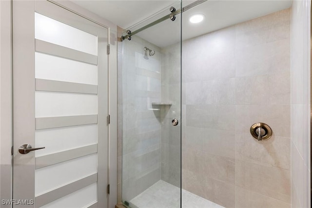 bathroom with a tile shower