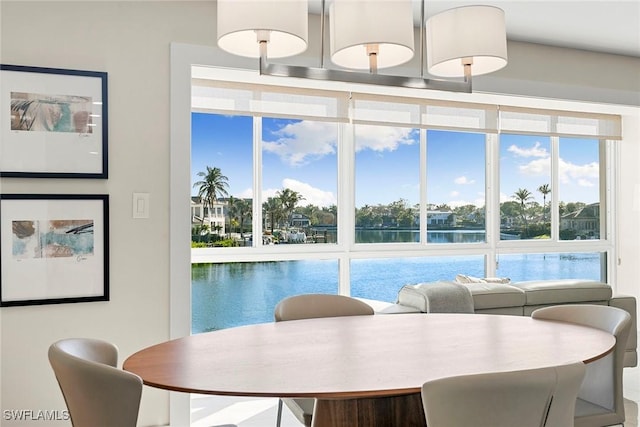 dining space with a water view