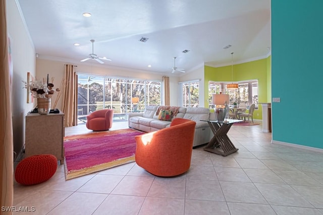 living room featuring crown molding, ceiling fan, and light tile patterned flooring