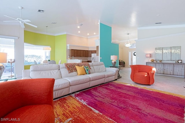 living room with ornamental molding and light tile patterned flooring