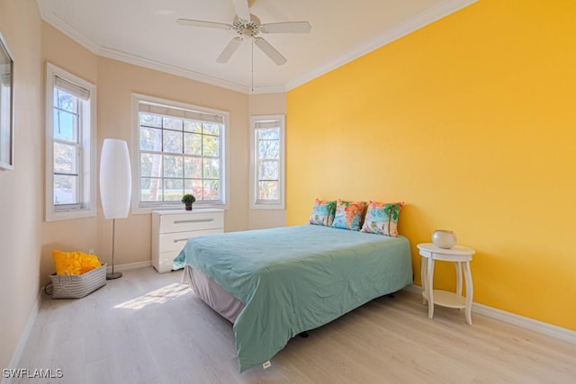 bedroom featuring crown molding, ceiling fan, and light hardwood / wood-style floors