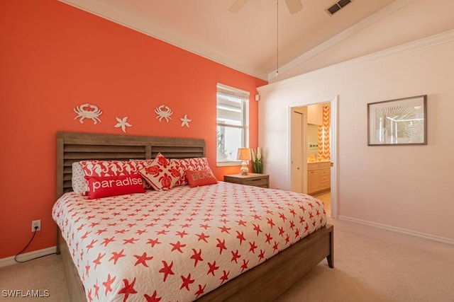 bedroom featuring ceiling fan, lofted ceiling, connected bathroom, and carpet