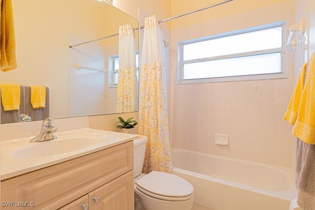 full bathroom featuring vanity, shower / bath combo, and toilet