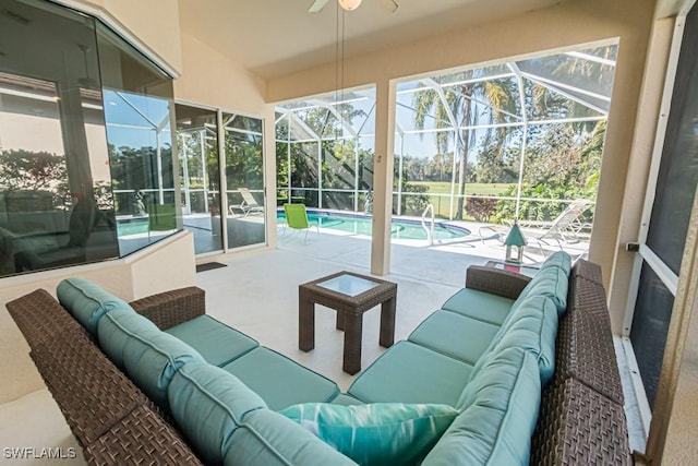 sunroom with a swimming pool, lofted ceiling, and ceiling fan