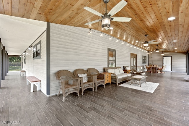 exterior space featuring outdoor lounge area and ceiling fan