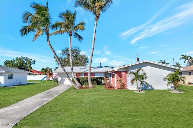 view of front of home with a garage and a front yard