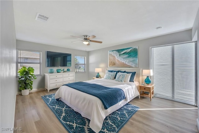 bedroom featuring light hardwood / wood-style flooring and ceiling fan