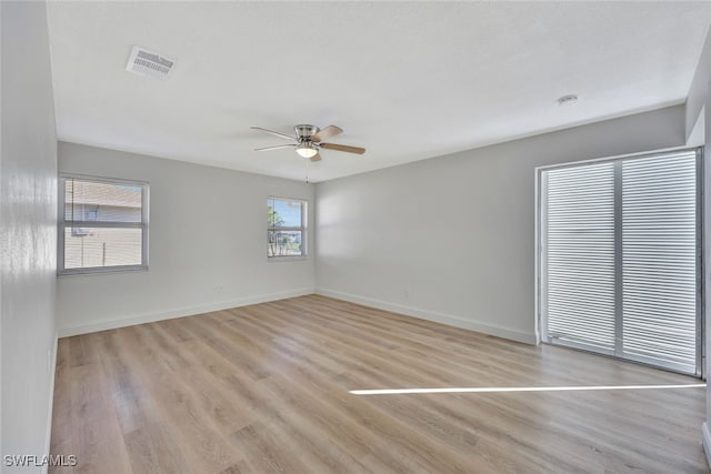 empty room featuring light hardwood / wood-style flooring and ceiling fan