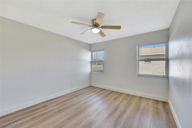 unfurnished room featuring ceiling fan and light hardwood / wood-style flooring