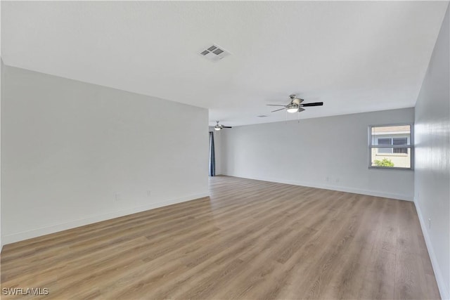 unfurnished room with ceiling fan and light hardwood / wood-style floors