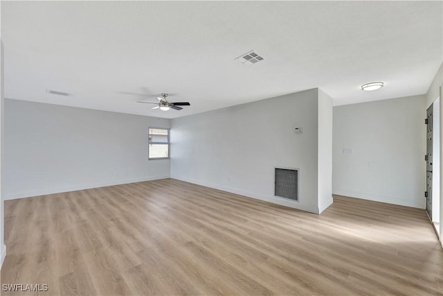 unfurnished living room with light hardwood / wood-style floors and ceiling fan