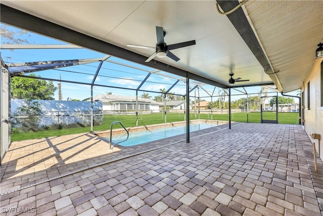 exterior space featuring ceiling fan, a mountain view, and glass enclosure