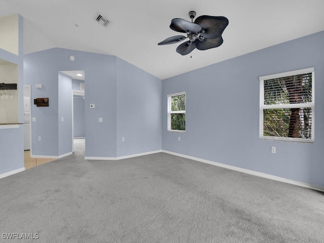 unfurnished living room featuring lofted ceiling, light colored carpet, and ceiling fan