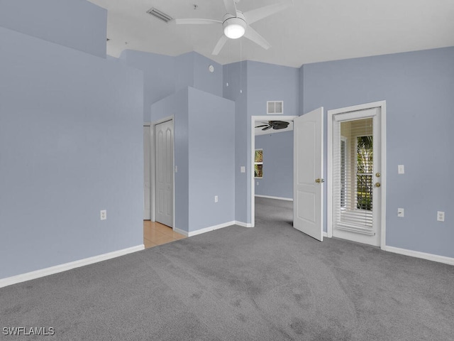 unfurnished bedroom with ceiling fan, light colored carpet, high vaulted ceiling, and access to outside