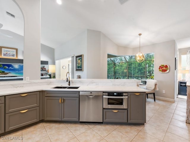 kitchen with sink, gray cabinets, and appliances with stainless steel finishes