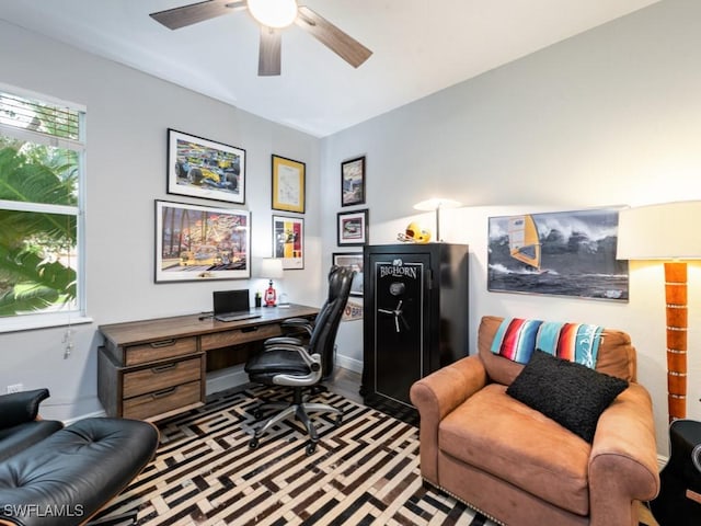 office area featuring dark hardwood / wood-style floors and ceiling fan