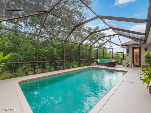 view of swimming pool featuring an outdoor hangout area, a lanai, and a patio area