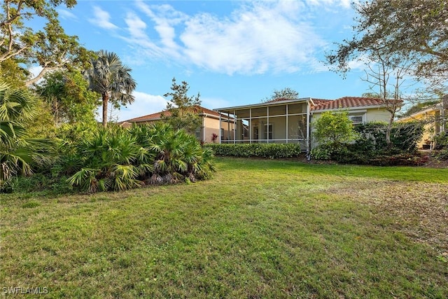 view of yard featuring a sunroom